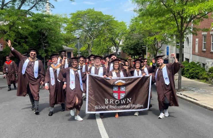The IE Brown Executive MBA graduating class celebrating their Ivy League MBA